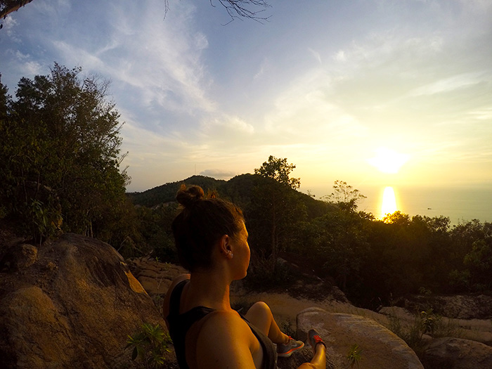 enjoying a sunset from atop a boulder in Koh Tao // Nattie on the Road