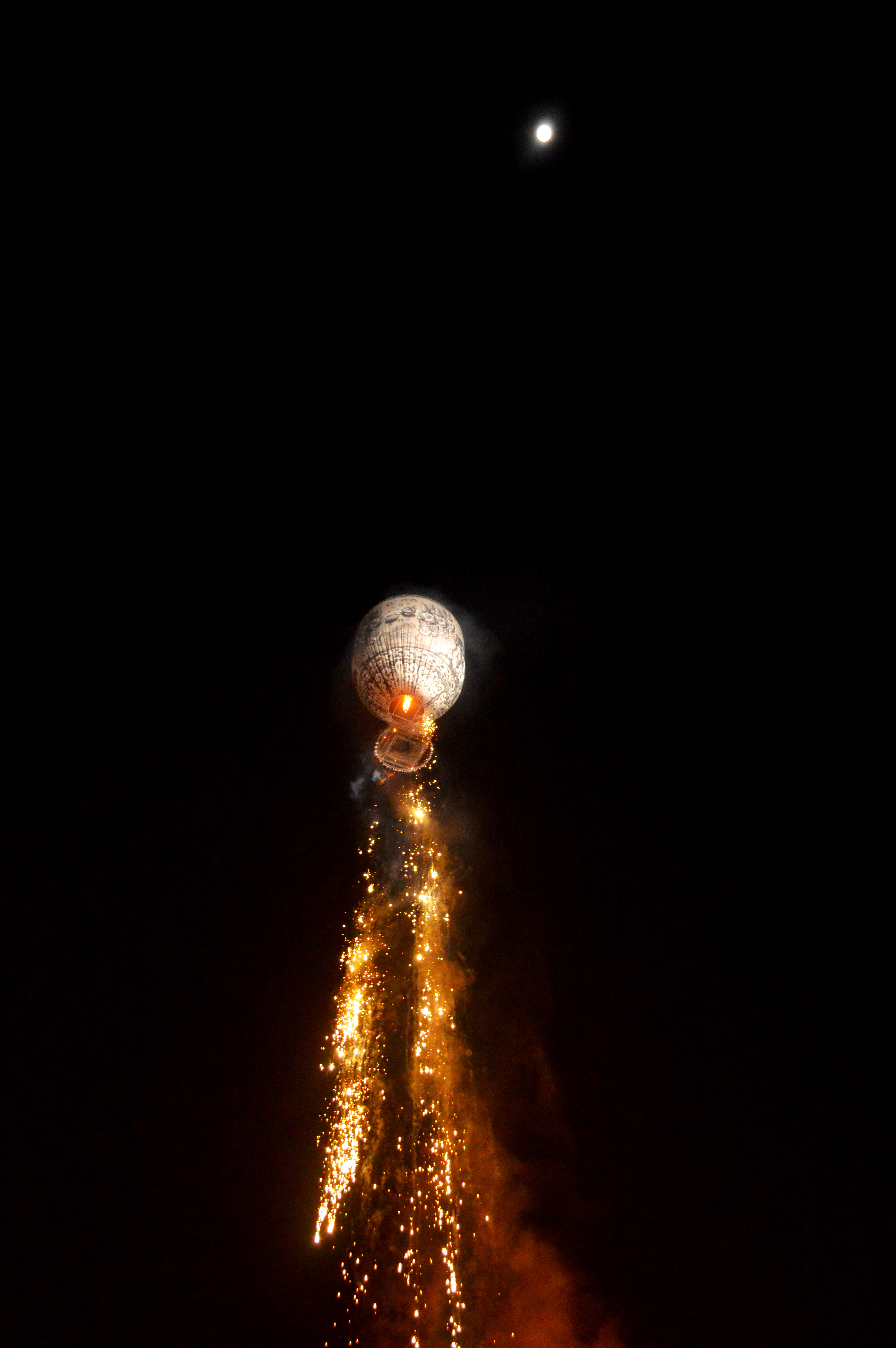 Hot air balloon heading up towards the moon