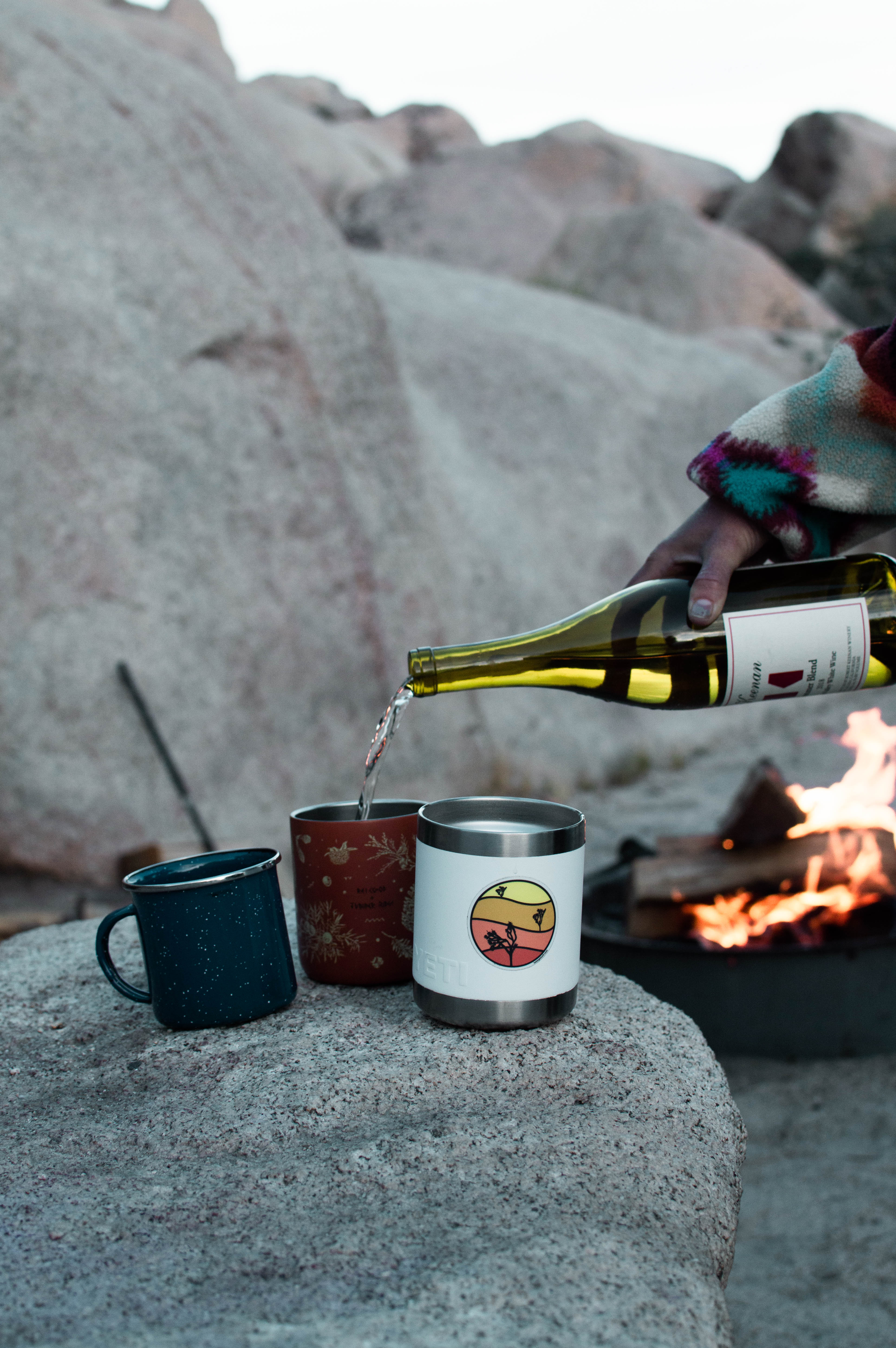 girls trip hangin around the campfire