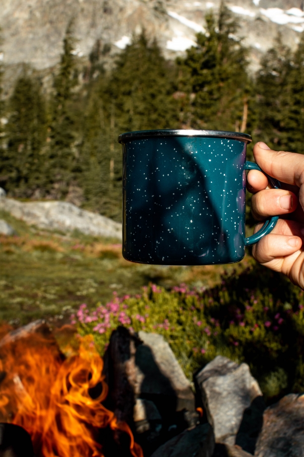 coffee mug next to the fire